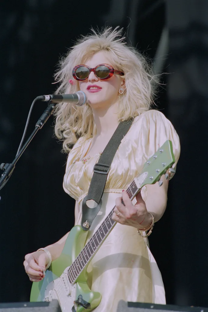 American musician and singer Courtney Love performs live on stage with rock group Hole at the 1994 Reading Festival in England on 26th August 1994. (Photo by Brian Rasic/Getty Images)