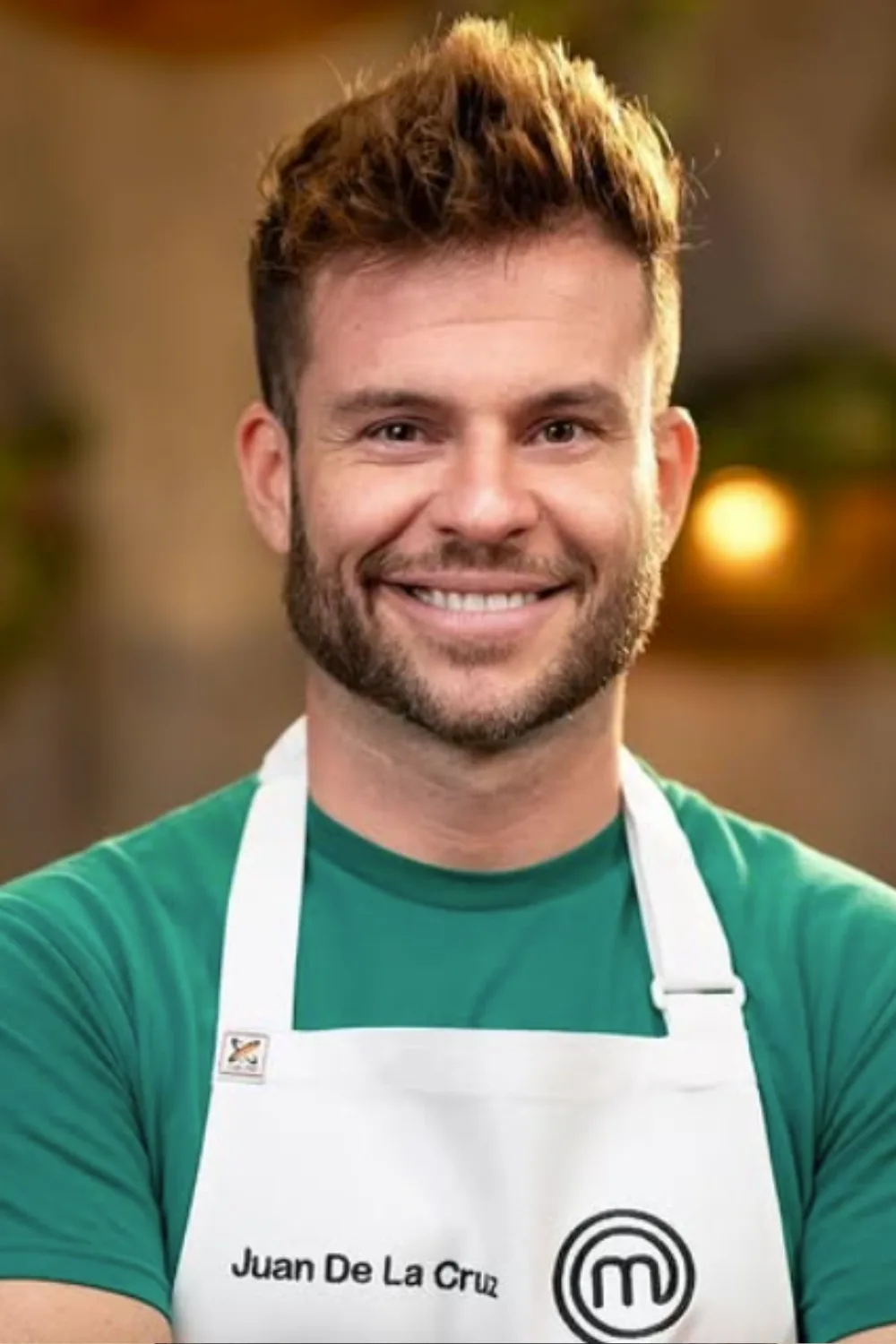 MasterChef's Juan De La Cruz wearing his white apron.