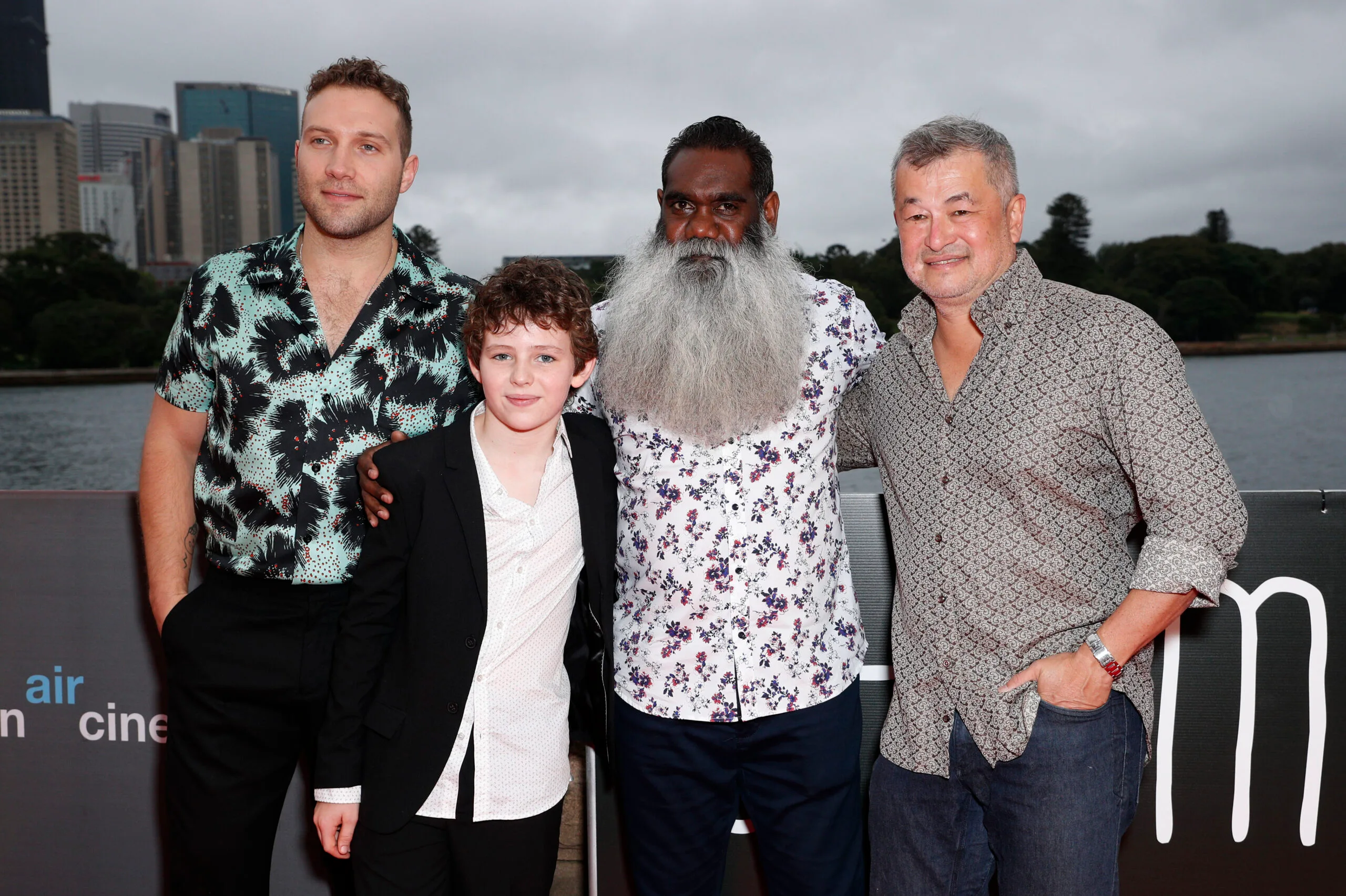 the cast of storm boy posing for a pic next to sydney harbour at the premiere