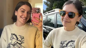 Two women wear a white jumper with a horse on it. Credit: Supplied