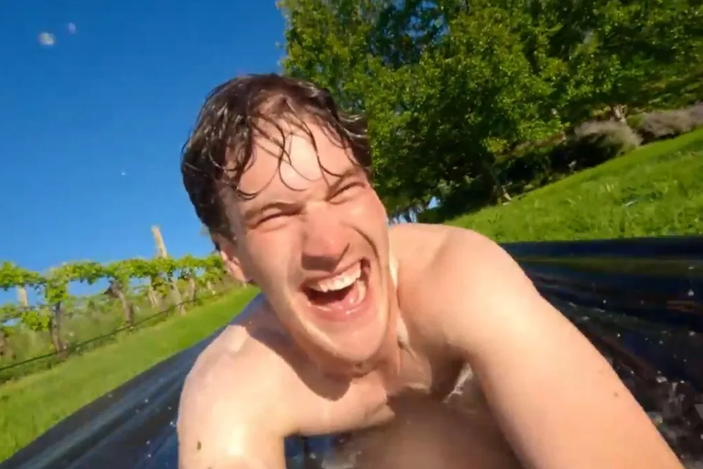 Farmer Zac on slip and slide on Farmer Wants A Wife