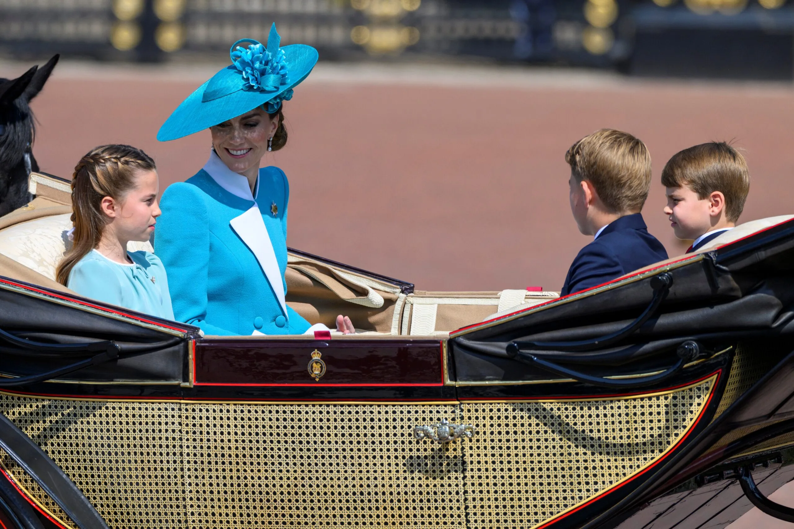 Kate and the kids in a carriage