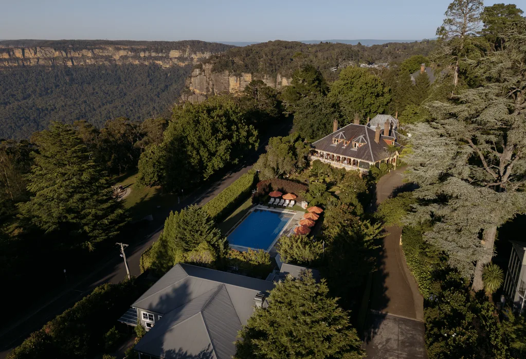 A stunning property with pool sits perched on the edge of a sweeping valley.