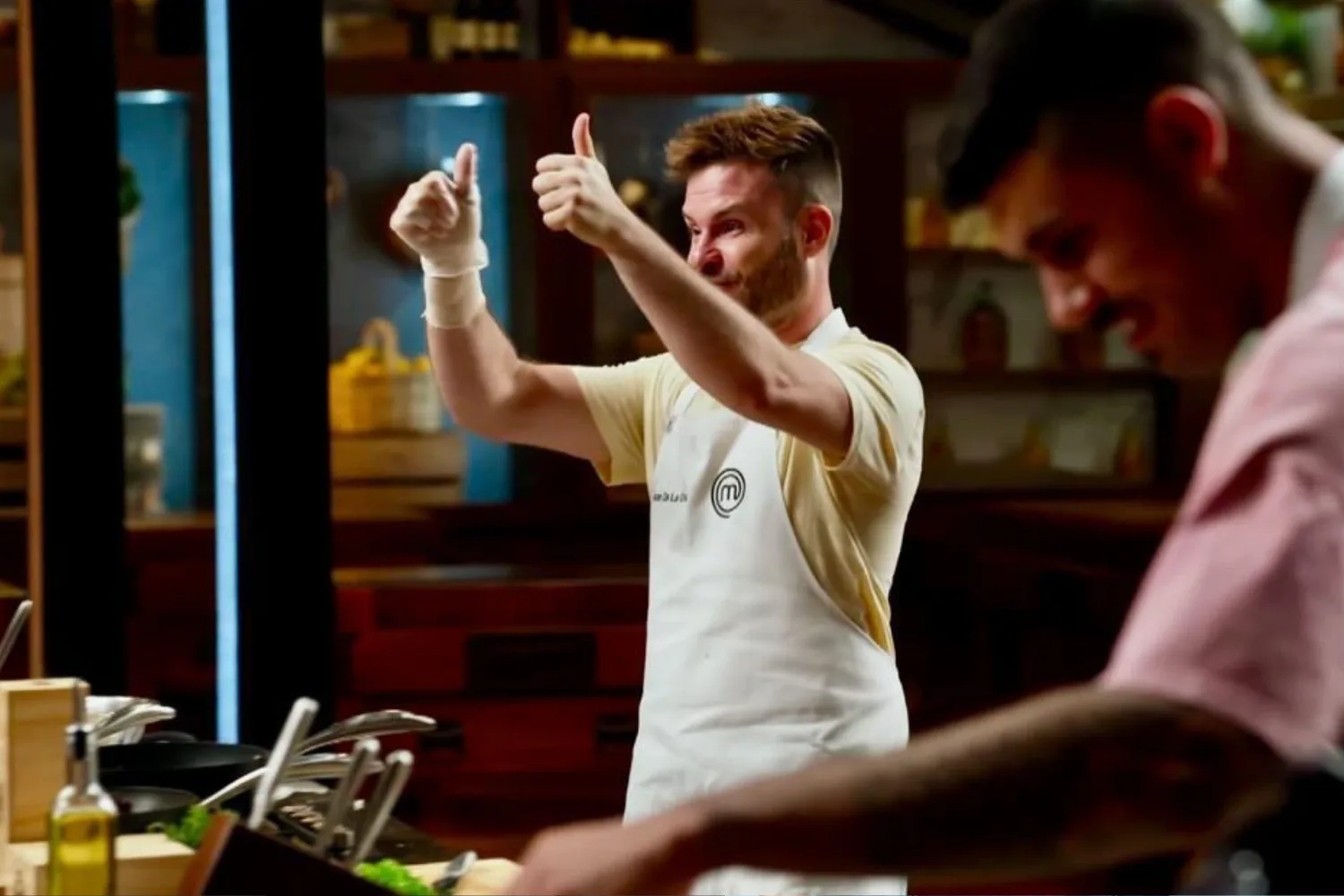 Juan De La Cruz with his thumbs up in the MasterChef kitchen.