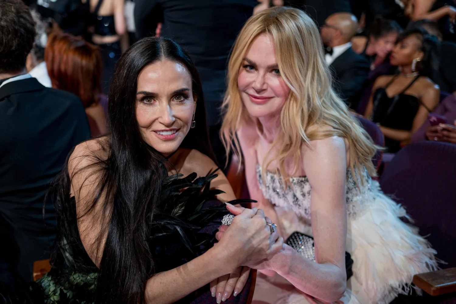 Demi Moore and Nicole Kidman pose together at an awards show. 