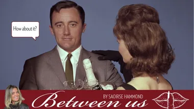 Man and woman with a bottle of prosecco.