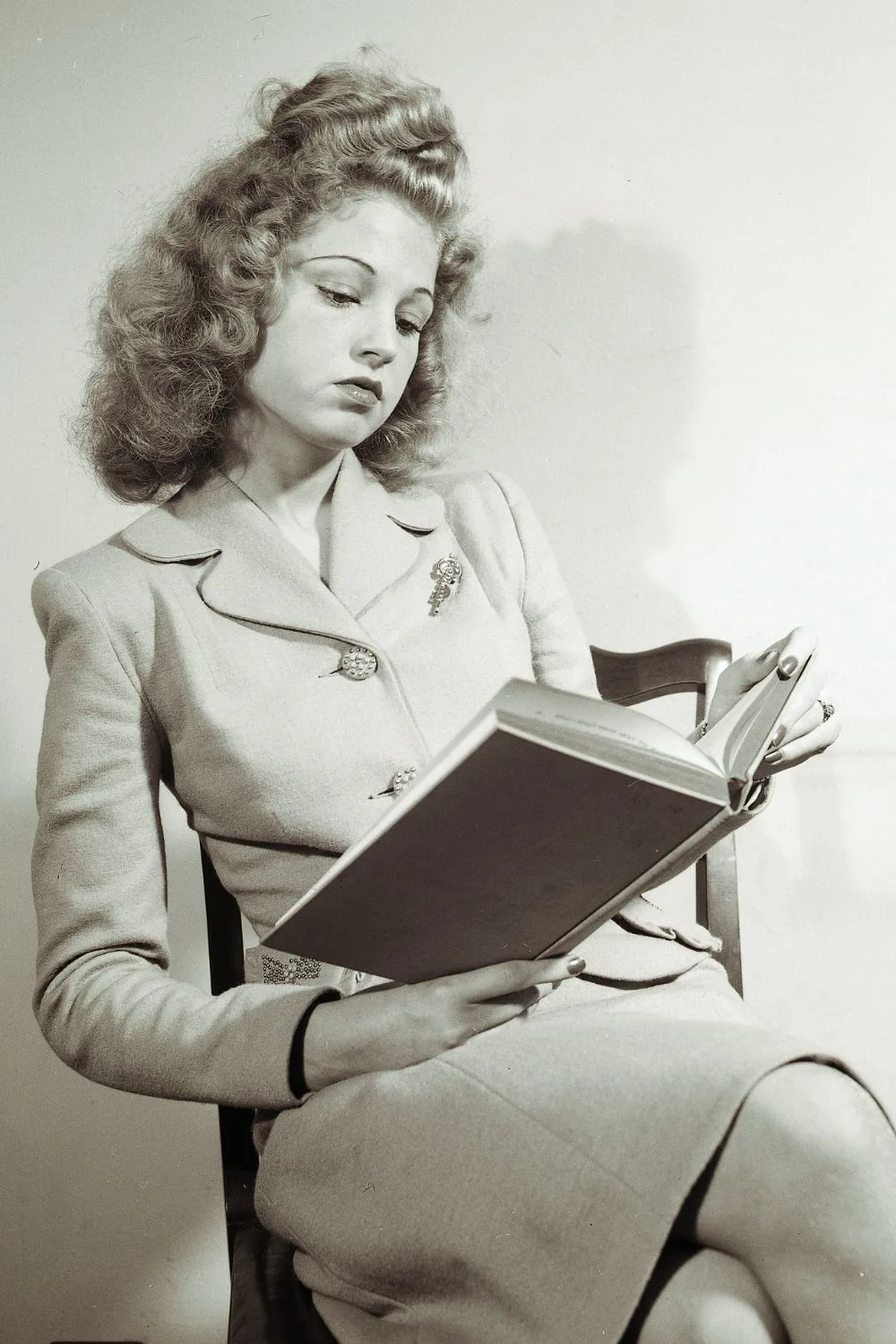 A woman reading a book.