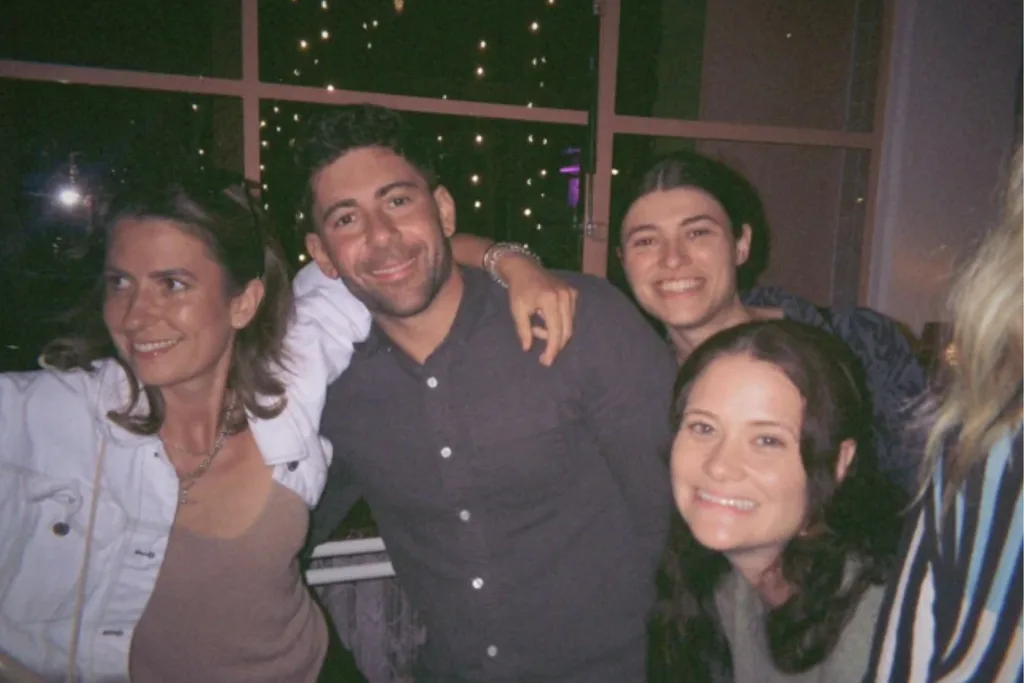 MasterChef contestants with Alyona draping her arm around Petro's shoulder.