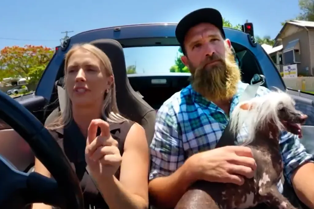 Farmer Wants A Wife Poppy driving and Farmer Jason holding her dog in the car.