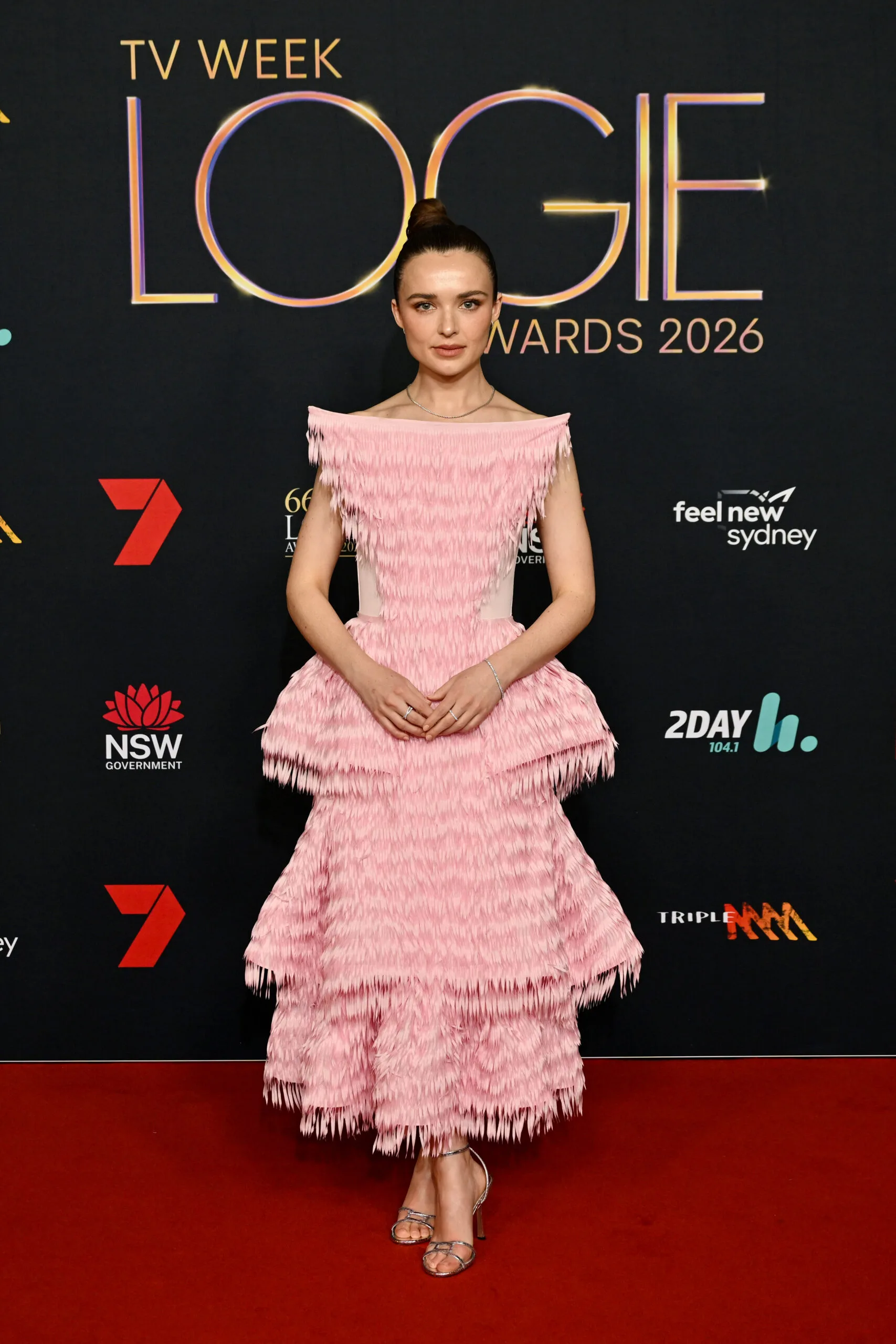 philipa northeast in a ruffly pink dress