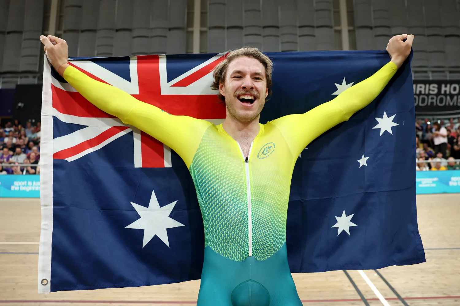 Leigh Hoffman holding up the Australian flag.