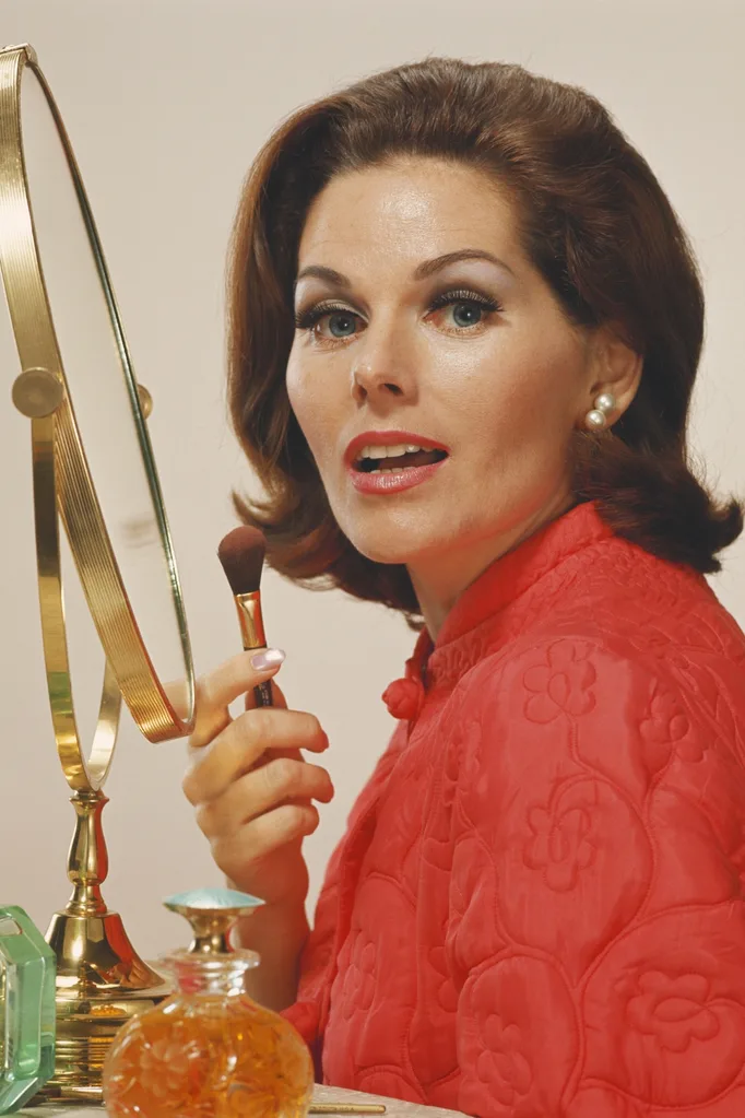 Woman doing make-up. Pic: Getty