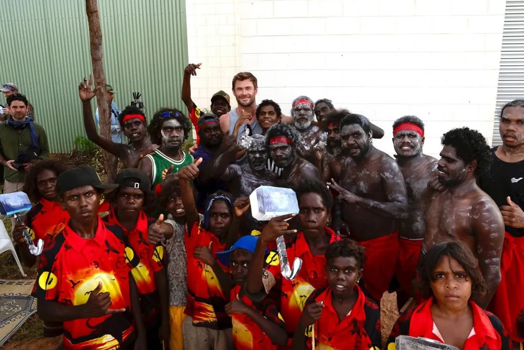Chris Hemsworth surrounded by residents of Bulman