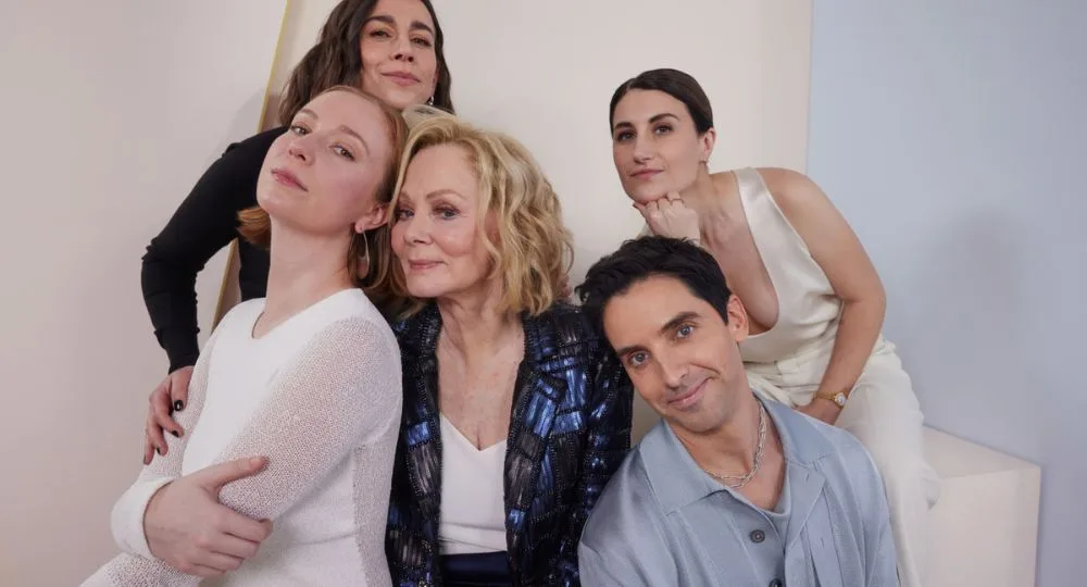 Jean Smart is surrounded by her co-stars from Hacks