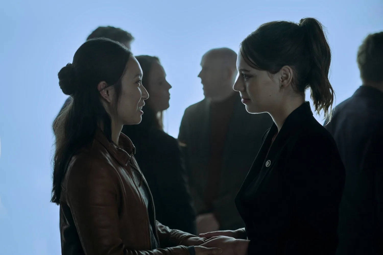 Jess Hong stands opposite Marlo Kelly in a scene from 3 Body Problem