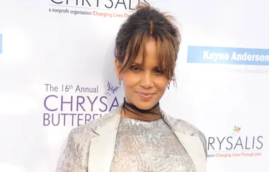 Actress in a sequined dress at the 16th Annual Chrysalis Butterfly Ball, smiling at the camera.