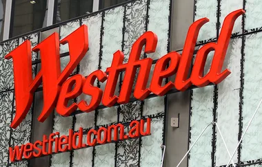 Red "Westfield" sign on a building with "westfield.com.au" below.