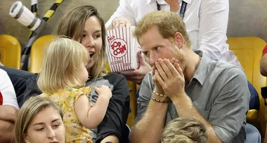 Prince Harry making funny faces at this baby are the photos you need right now