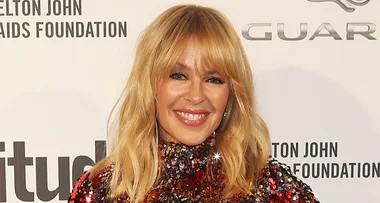 Kylie Minogue sparkles in a sequin mini dress