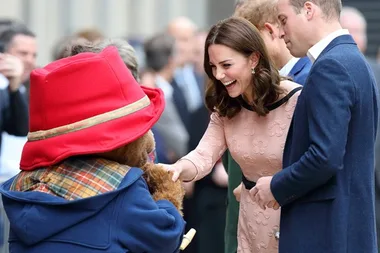 Kate Middleton shows off her baby bump during a kids charity event at Paddington Station