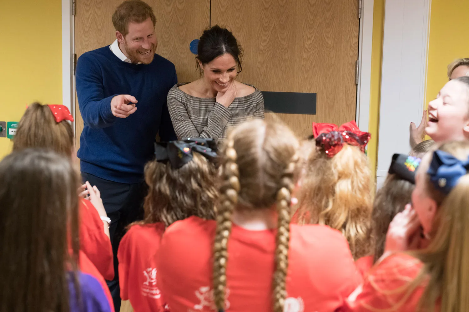 Meghan Markle gets the sweetest group hug as Prince Harry jokes "She's(00)