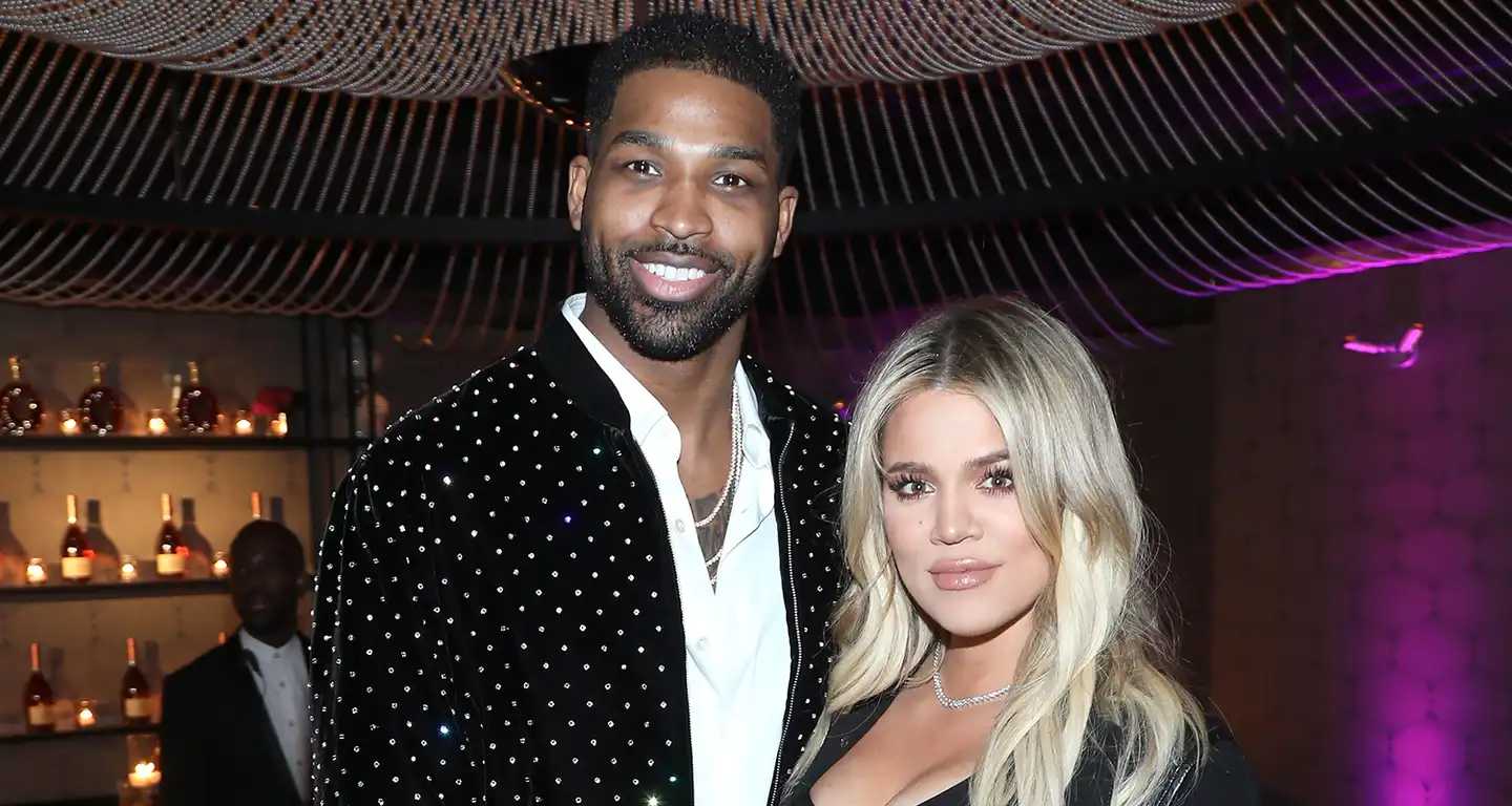 Pregnant Khloe Kardashian poses with Tristan Thompson as he cradles her