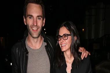 Courteney Cox shares a sweet airport kiss with boyfriend Johnny McDaid