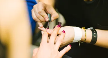 Woman unhappy with her Manicure so she allegedly dragged salon employee across parking lot with her car