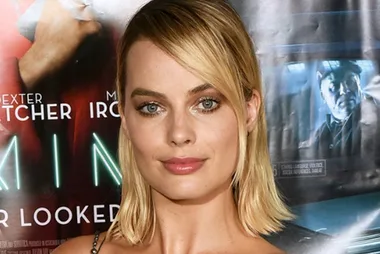 Margot Robbie steps out in lace see-through dress
