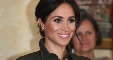 Meghan wears $2,555 green dress and chats to Missy Higgins