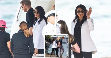 Casual Meghan waves aboard boat in Sydney Harbour