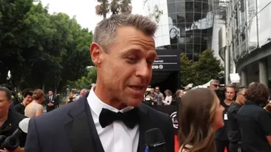 Who interviews Rodger Corser at the AACTAs