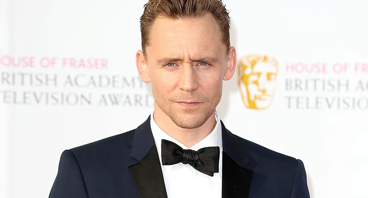 Man in a tuxedo at BAFTA Television Awards with a serious expression.