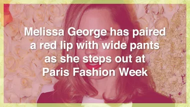 Melissa George pairs red lipstick with wide pants at Paris Fashion Week