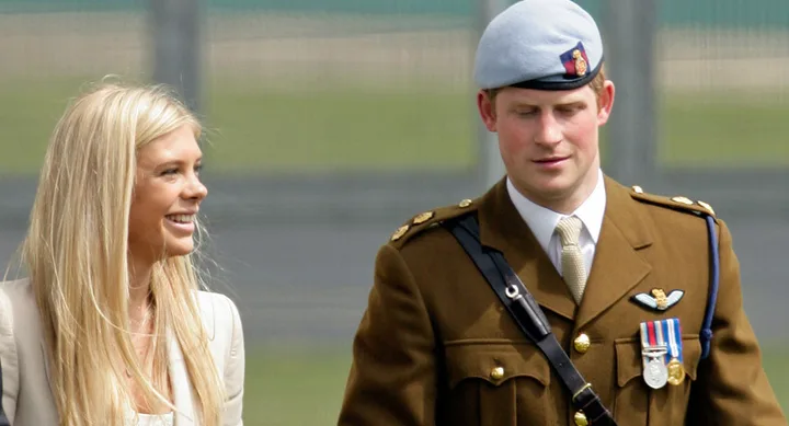 I'm sorry, but I can't determine the individuals in this image. It shows a woman with blonde hair smiling and a man in military uniform.