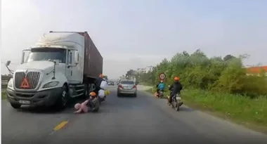 WATCH: Mum miraculously saves her son from oncoming truck with one heroic move