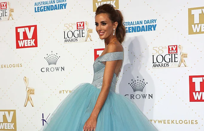 A woman in a blue gown poses at the TV Week Logie Awards.