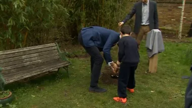 Prince Harry planting a tree with the help of some very cute kids!