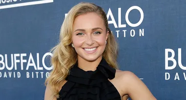 ```plaintext
Person smiling at a Buffalo David Bitton event, wearing a black dress.
```