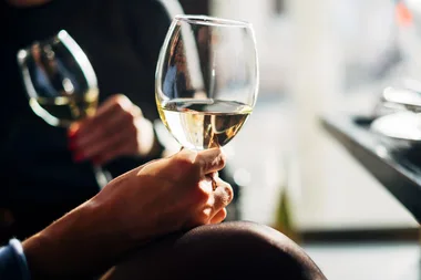 A new study shows that fake smiling at work makes you more likely to drink