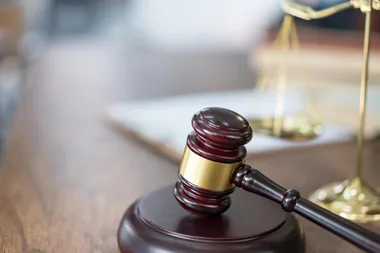 Wooden judge hammer in court