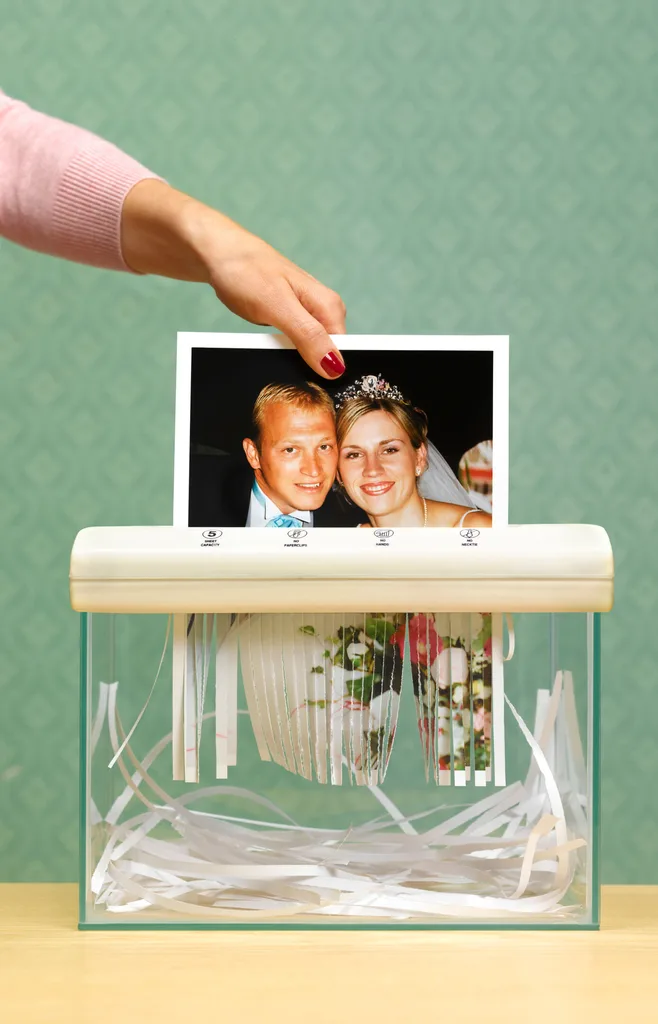 A wedding photo of a couple being shredded