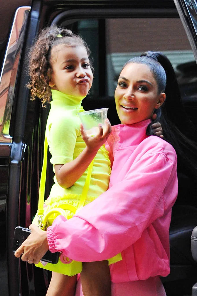 Kim Kardashian holding her daughter