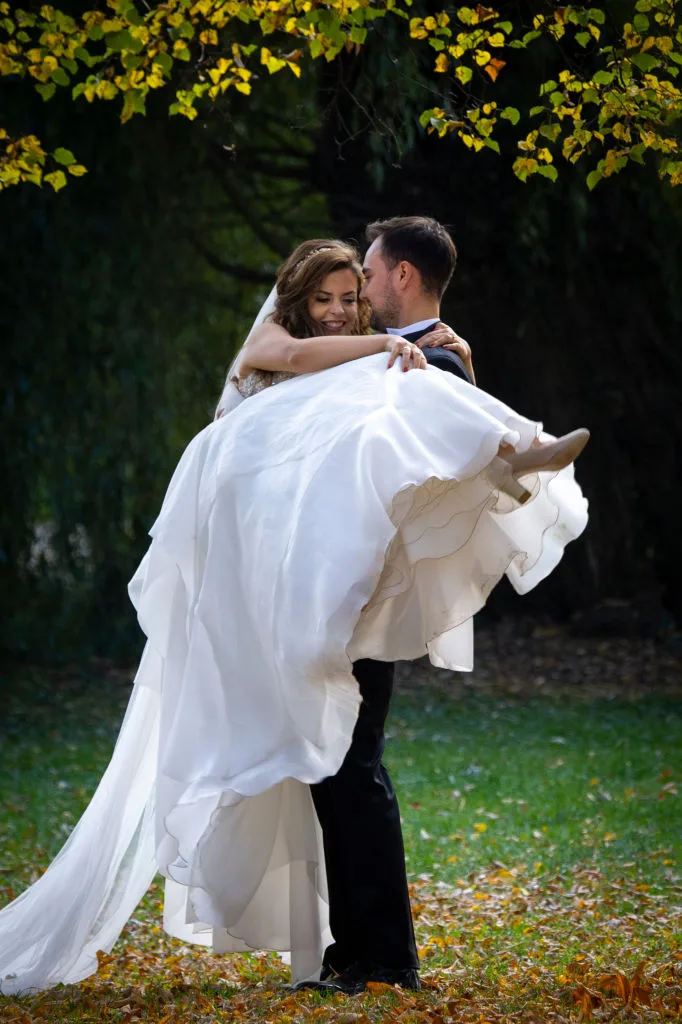 Groom holding a groom in a wedding dress
