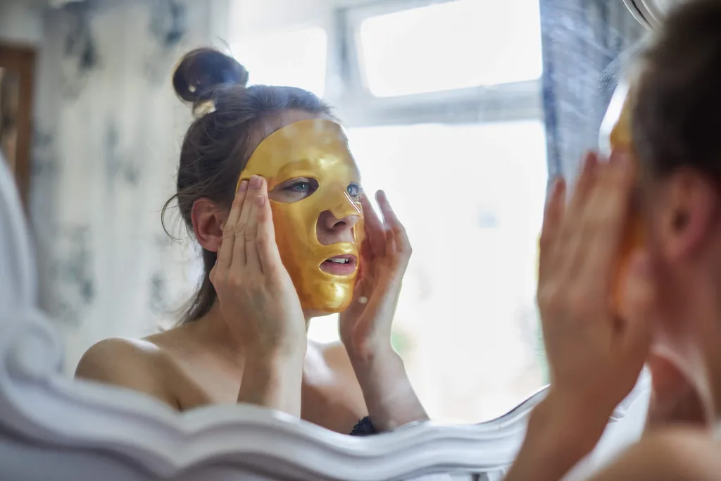 A lady doing a facial treatment