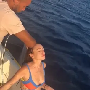 LiLo washes hair on yacht