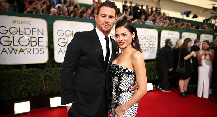 Couple posing on the red carpet at the Golden Globe Awards.