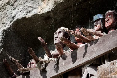 Traditional Torajan Wooden Effigies with outstretched hands