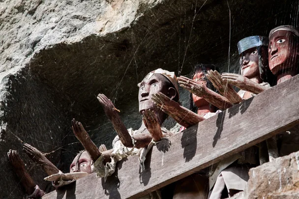 Traditional Torajan Wooden Effigies with outstretched hands