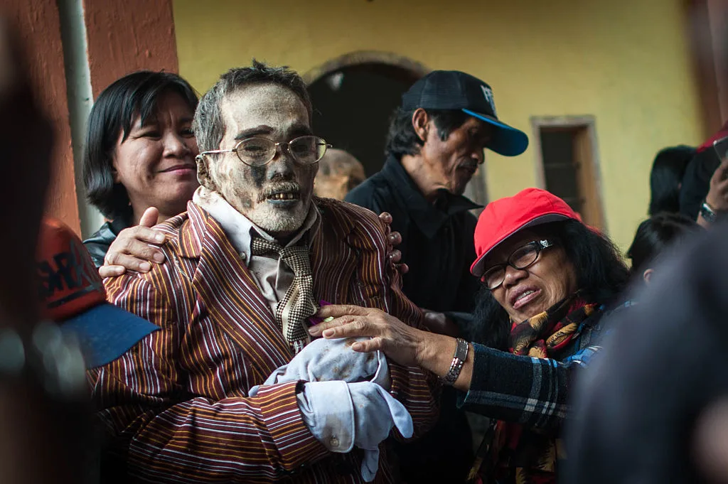 Mummies getting a change of clothing during a traditional Ma-nene Ritual in Indonesia